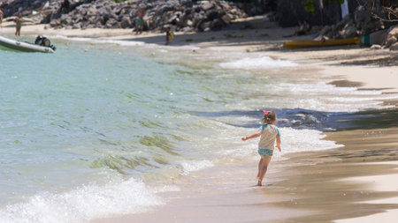 A girl running on the beachの写真素材