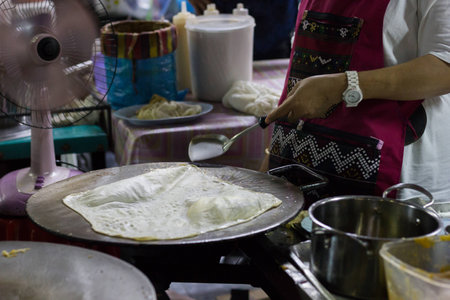 Cooking a Roti, thai style foodの写真素材