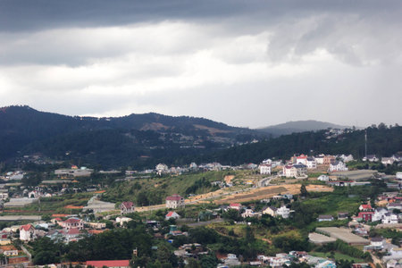 The city on the mountain with rain cloud in Dalat, Vietnamの写真素材