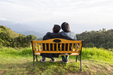 Two asia man on the chair with nature view on the mountainの写真素材