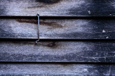 Old wooden wall with hook at Thai house in Bangkokの写真素材