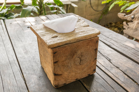 A wooden tissue box on the wooden tableの写真素材