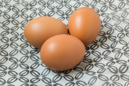 Eggs on tableclothの写真素材