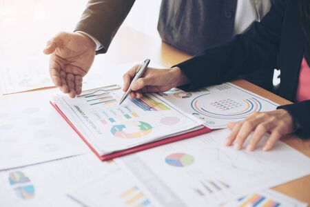 close up hand of marketing manager employee pointing at business document during discussion at meeting room  - Business conceptの写真素材