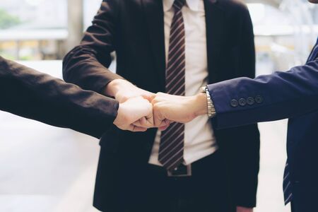 Team business partners giving Touch the punch ,Successful teamwork partnership , business conceptの写真素材
