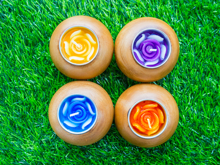 Beautiful scented candles on the green lawn.の写真素材