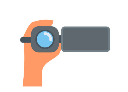 Hand holding camcorder. Simple flat illustration.のイラスト素材
