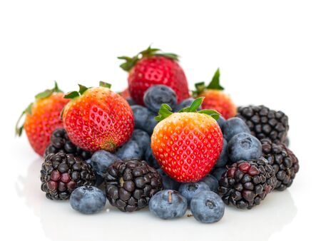 Blackberries, blueberries and stawberries on white background.の写真素材