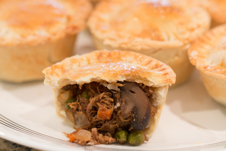 Meat pie on a white plate.の写真素材
