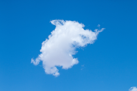 White cloud look like the elephant, in the blue skyの写真素材