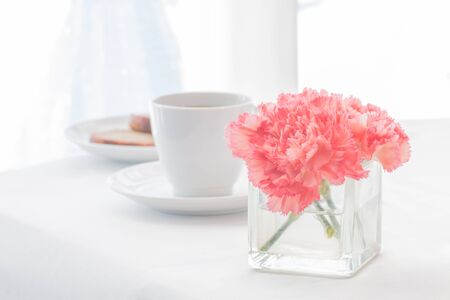 Carnations flowers and breakfast in the morning. Foft filter.の写真素材