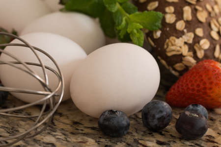Eggs , bread and ingredients prepare for cooking on marble table.