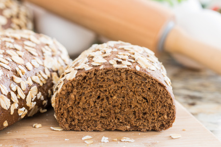 healthy wholemeal bread, on marble table.の写真素材