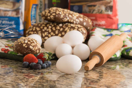 Eggs , bread and ingredients prepare for cooking on marble table.の写真素材