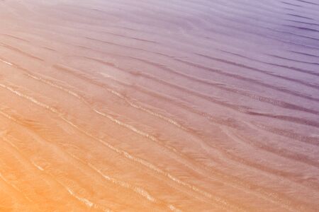 Sand on the beach pastel color filter ,Beautiful waves on sand, nature abstract background.の写真素材