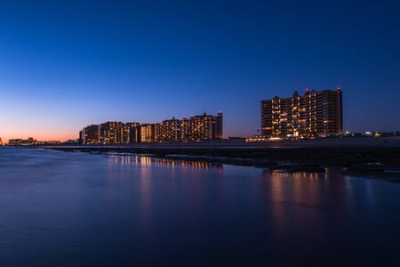 Sunset over a rocky beach in front the hotels at Puerto Penasco (Rocky Point) Mexico.のeditorial素材