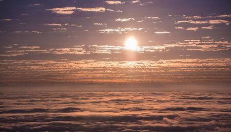 Sun Rise over sea of mist with violet skyの写真素材