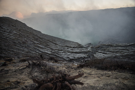 Waste land with Sulfur smokeの写真素材