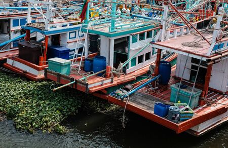 The fisherman in colorful boatの写真素材