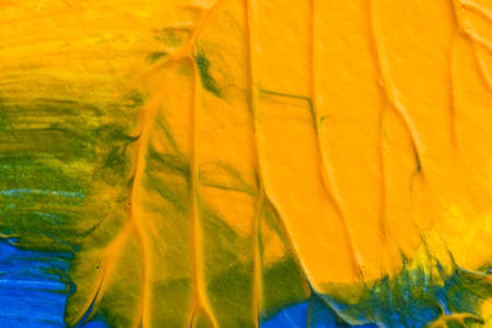 I painted acrylic colors on white paper and I folded the paper together similar to the rorschach inkblot method that create the texture of mixed acrylic colors.の写真素材