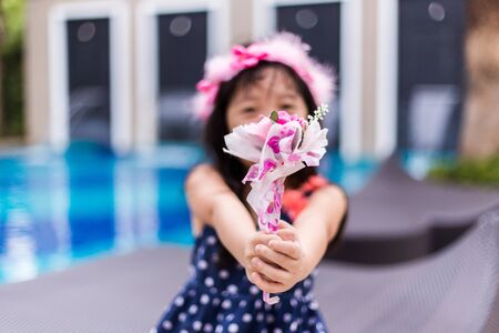 Lovely Girl Giving Flowersの写真素材