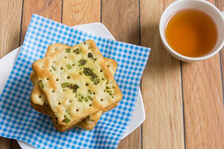 Stack of salty vegetable flavored crackers.の写真素材