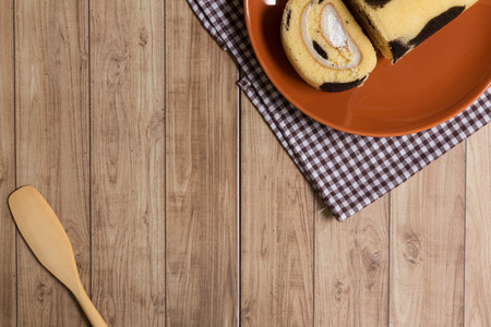 Cake roll with cow-skin pattern inserted with fresh milk cream.の写真素材