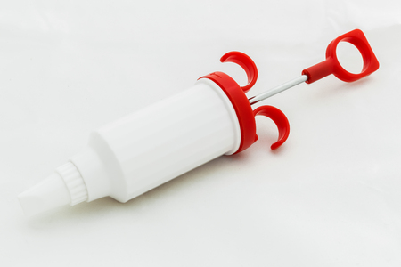 Icing Syringe Isolated on Whiteの写真素材