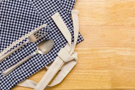 Spoon and Fork on Table Background