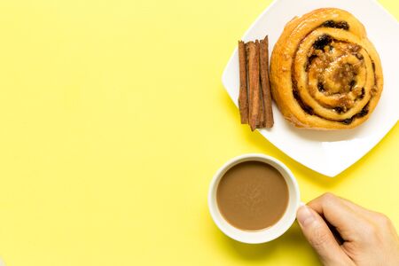 Cinnamon Roll with Coffee Backgroundの写真素材