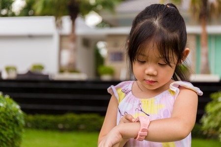 Child Using Smartwatch or Smart Watch. Child with Smartwatch or Smart Watchの写真素材