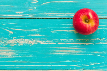 Apple on Vintage Wooden Backgroundの写真素材