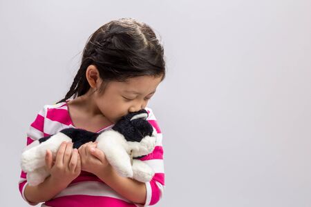 Little Girl with Doll Backgroundの写真素材