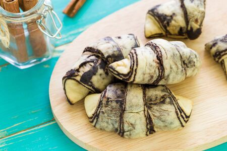 Croissant on Vintage Wooden Backgroundの写真素材