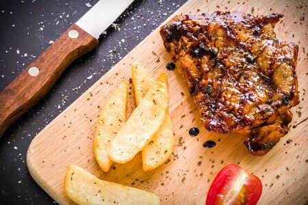Chicken Steak on Wooden Plateの写真素材