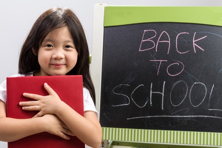 Kid Holding Book Illustrating Education Concept