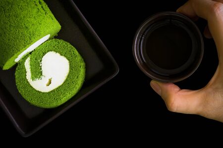 Cake with Tea on Black Background