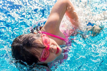 Child Swimming in Poolの写真素材