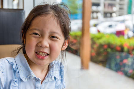 Happy Asian Child Smiling Portraitの写真素材