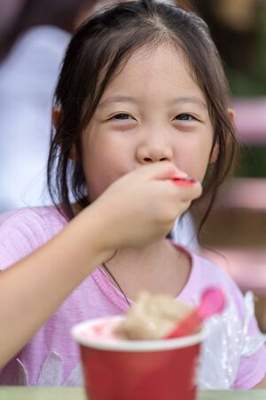 Happy Kid Eating Ice Creamの写真素材