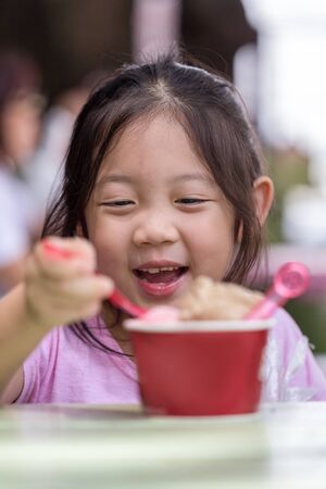 Happy Child Eating Ice Creamの写真素材
