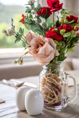 Table Setting with Rose in Cafeの写真素材