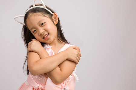 Kid with Cat Ear Headband, Isolated on Whiteの写真素材