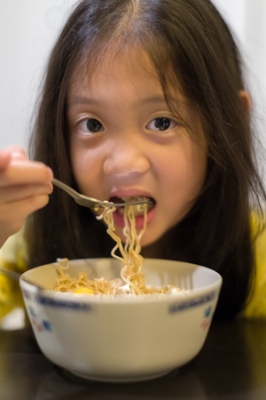 Child Eating Noodleの写真素材