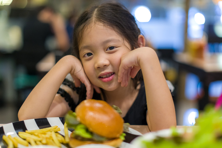Child Eating Hamburgerの写真素材