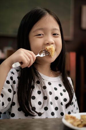 Kid Eating Pastry Snack, Vintageの写真素材