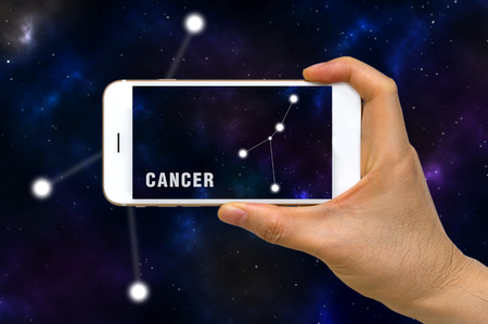 Augmented Reality, AR, of Cancer Zodiac Constellation App on Smartphone Screen Conceptの写真素材