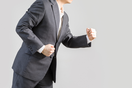 Success Concept Illustrated by Businessman in Rush Running Forward, Isolated on White Backgroundの写真素材