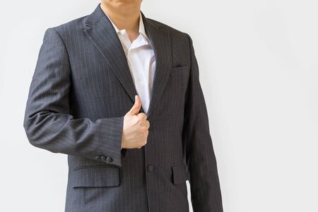 Businessman in Suit Showing Thumb Up as Concept of Success, Isolated on White, Studio Shotの写真素材