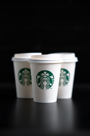 Bangkok, Thailand â August 26, 2018: Cups of Starbucks Coffee on Black Background. Starbucks is one of the largest coffee chain stores in the world.のeditorial素材